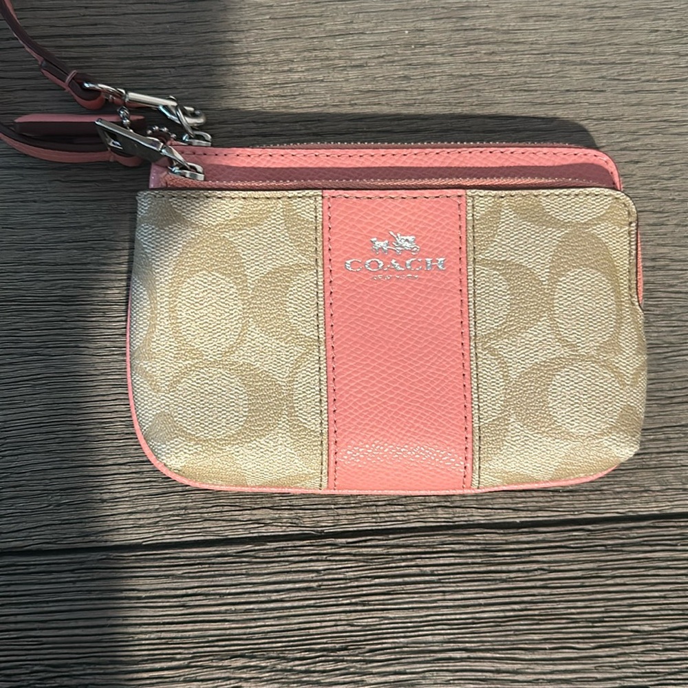 Small pink and beige Coach wristlet